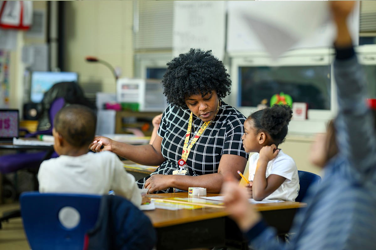 Teacher helping a student
